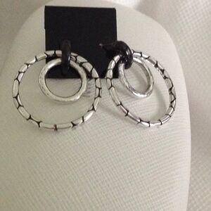 Artisan made two-tone double hoop earrings.